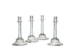 A set of four facet-cut candlesticks in the late 18th century style