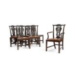 A matched set of seven George II style carved mahogany dining chairs, late 19th century