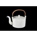 A English creamware punch kettle with wicker handle