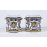 A pair of French fayence Rouen-style polychrome octagonal section bottle coolers