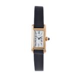 Cartier, a gold coloured wrist watch