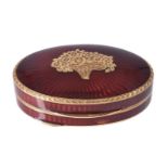 A red guilloche enamel oval pill box