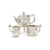 ϒ An Aesthetic Movement silver small three piece tea service by Elkington & Co.