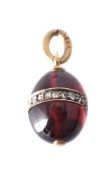 A late 19th century Russian garnet and diamond egg pendant by Karl Bok