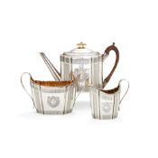 ϒ A George III silver shaped oval three piece tea service by Henry Chawner & John Eames