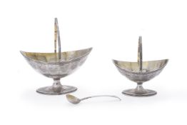 A George III silver navette pedestal cream basket, matching sugar basket and spoon by Charles Hougha