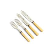 ϒ A set of twelve silver and ivory fish knives and forks by John Round & Son