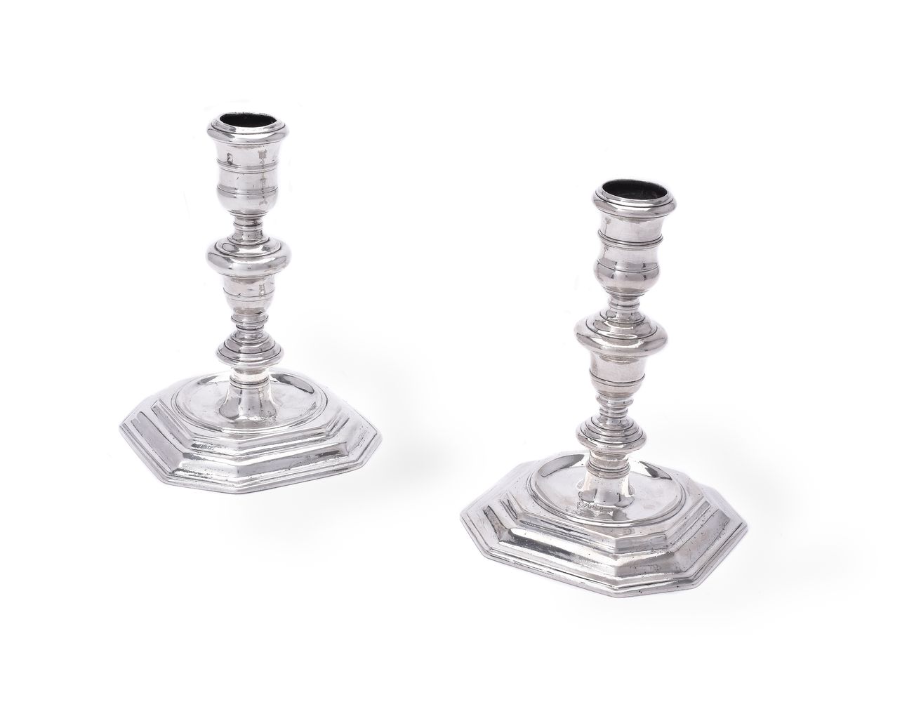 A matched pair of cast Britannia standard silver candlesticks