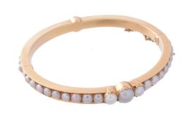 A late Victorian half pearl bangle by Carlo Giuliano