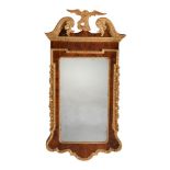 A George II walnut and parcel gilt mirror, circa 1740