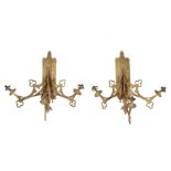 A pair of unusual Continental gilt metal three light wall appliques in Gothic Revival taste, circa 1