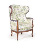 A Louis XVI walnut and upholstered wing armchair, late 18th century