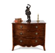 A George III mahogany and goncalo alves serpentine chest of drawers, circa 1790