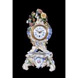 A Meissen (punkt) flower-encrusted clock case and stand, circa 1770