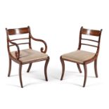 A set of ten Regency mahogany and brass mounted dining chairs, circa 1815