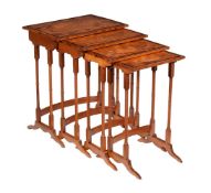 ϒ A nest of satinwood, ebonised, and rosewood banded quartetto tables, second quarter 19th century