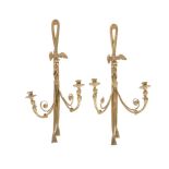 A pair of French gilt bronze twin light wall appliques in Empire taste, early 20th century