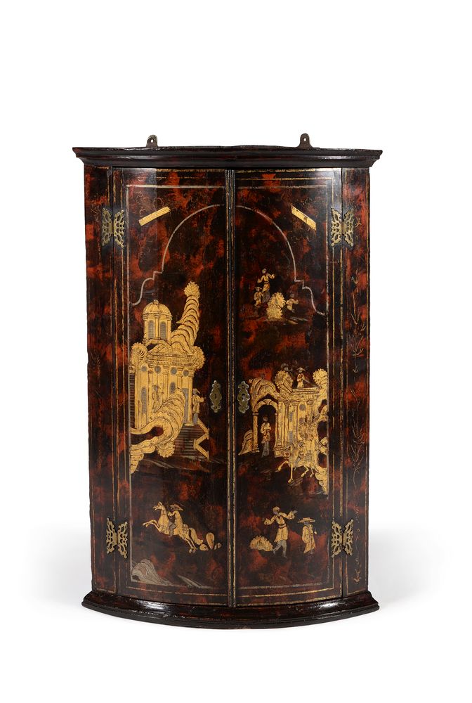 A George I simulated tortoiseshell and gilt chinoiserie decorated bowfront hanging corner cupboard,