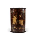 A George I simulated tortoiseshell and gilt chinoiserie decorated bowfront hanging corner cupboard,