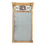 A Regency giltwood and reverse painted glass wall mirror, circa 1815