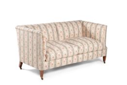 A Victorian mahogany and upholstered sofa by Howard & Sons