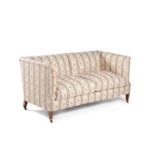 A Victorian mahogany and upholstered sofa by Howard & Sons