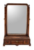 A George II walnut and feather banded dressing mirror, circa 1735