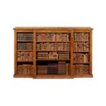 A Victorian walnut, figured burr walnut and gilt metal mounted breakfront bookcase, circa 1860