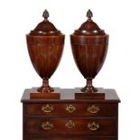 A pair of mahogany and boxwood strung cutlery urns, in George III style, late 19th/ early 20th centu