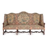 † A French walnut and needlework upholstered settee, 18th century and later elements