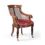 A George IV mahogany bergere library armchair, circa 1825, in the manner of Gillows