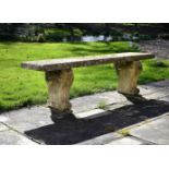 A Regency carved stone garden bench