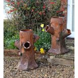 A pair of salt glazed terracotta 'faux bois' strawberry planters, last quarter 19th century