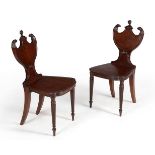 A pair of Regency mahogany hall chairs, circa 1815