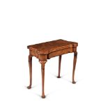 A George II walnut and feather banded card table, circa 1730