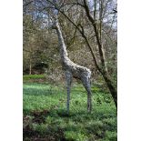 A large patinated metal garden model of a standing giraffe, late 20th century