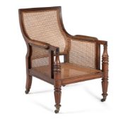 † A Regency mahogany bergère library armchair, circa 1815