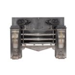 A Regency brass mounted, polished steel and cast iron fire grate, in the manner of George Bullock, c