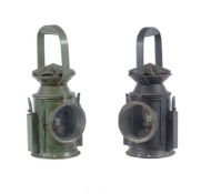 Two period military railway signal lamps