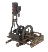 A vintage model of a vertical live steam engine