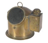 A ships compass in polished brass cylindrical case