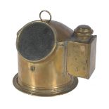 A ships compass in polished brass cylindrical case