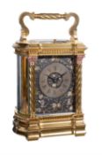 A gilt carriage bow-sided carriage clock with relief cast dial, late 19th century