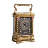 A gilt carriage bow-sided carriage clock with relief cast dial, late 19th century