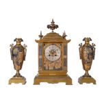 A French brass mantel clock garniture with relief cast panels, Achille Brocot, Paris, circa 1880