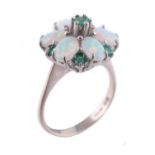 An opal and emerald cluster ring