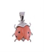 A coral ladybird pendant