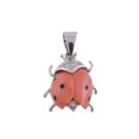 A coral ladybird pendant