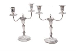 An Edwardian pair of two-branch silver candelabra by Hawksworth