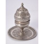 An Egyptian silver coloured incense burner on integral stand (buhurdan)